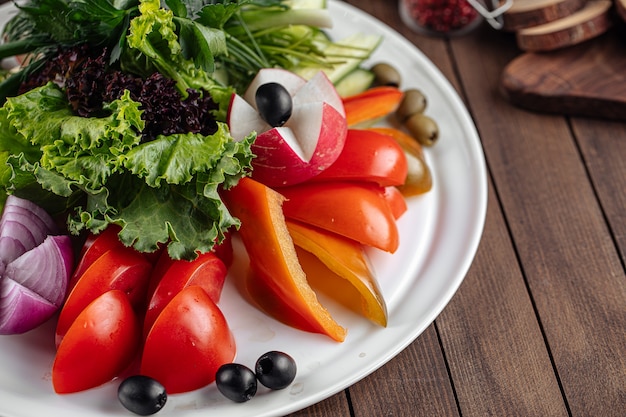 Fresh vegetables platter with greens