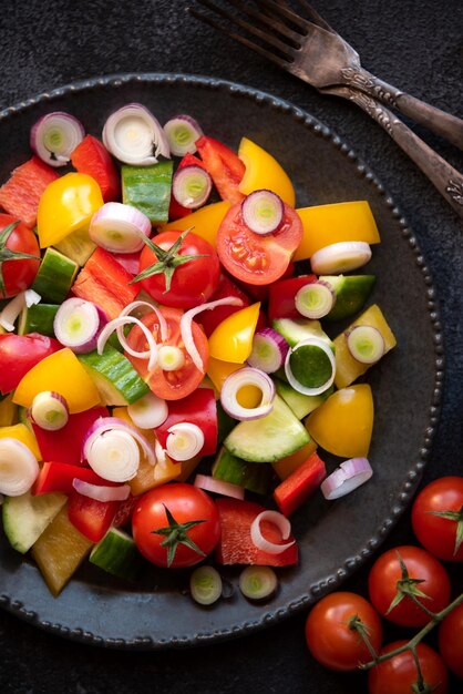 Fresh vegetables salad with tomatoes peppers cucumbers and other ingredients healthy eating