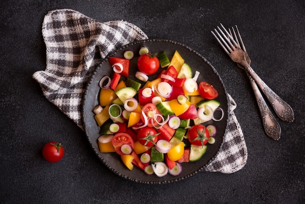 Fresh vegetables salad with tomatoes peppers cucumbers and other ingredients healthy eating