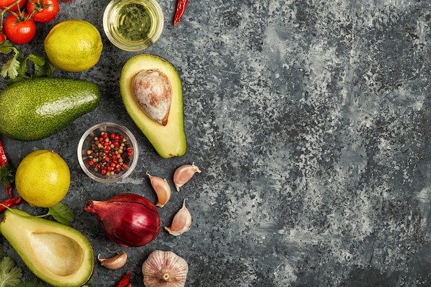 Fresh vegetables and spices on a concrete table