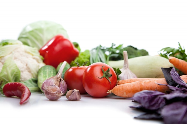 Fresh vegetables on white.