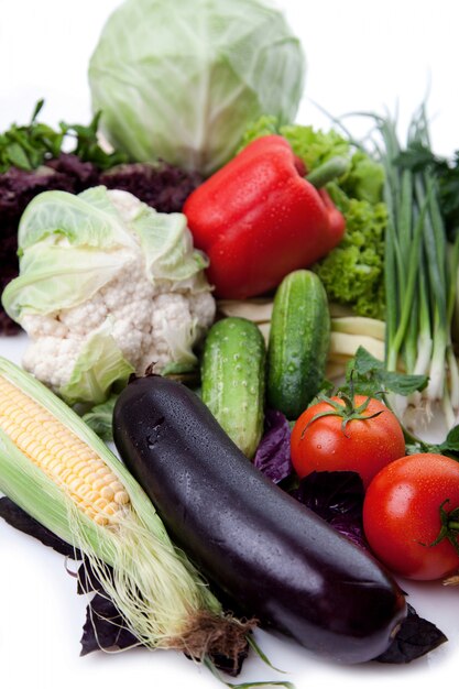 Fresh vegetables on white.