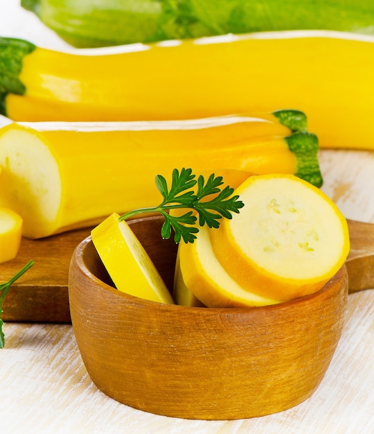 Fresh vegetables with herbs on a wooden board