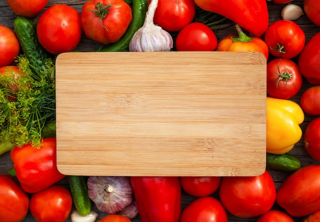 Fresh vegetables and wooden board