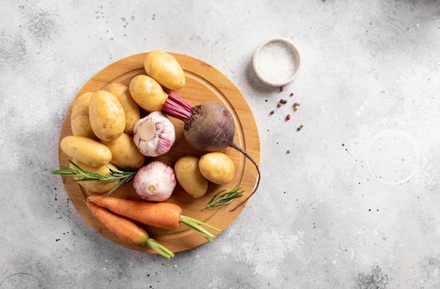 Fresh vegetables on a wooden cutting board