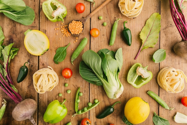 Photo fresh vegetables on wooden table flat lay