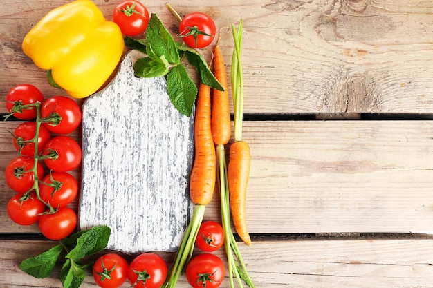 Fresh vegetables on wooden table top view