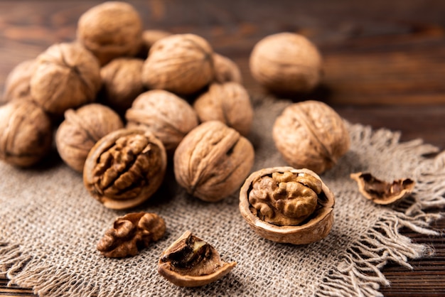 Fresh walnuts on a dark wooden table