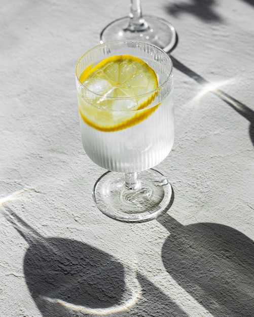 Fresh water with lemon and ice Food photography in bright sunlight