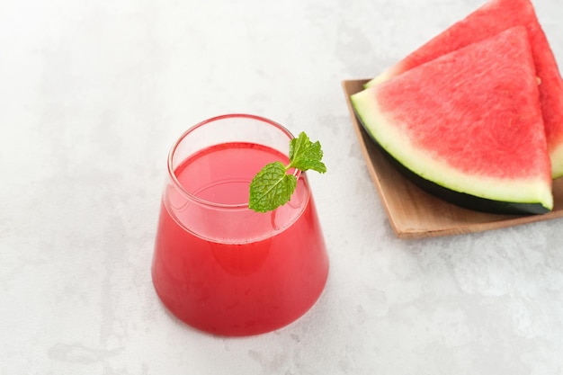 Fresh watermelon juice with mint, cold pressed juice. Healthy drink concept.