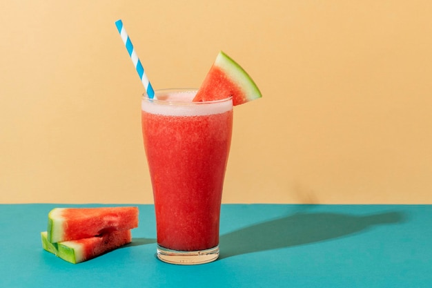 Fresh watermelon smoothie on colorful background