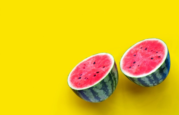 Fresh watermelon on yellow background.