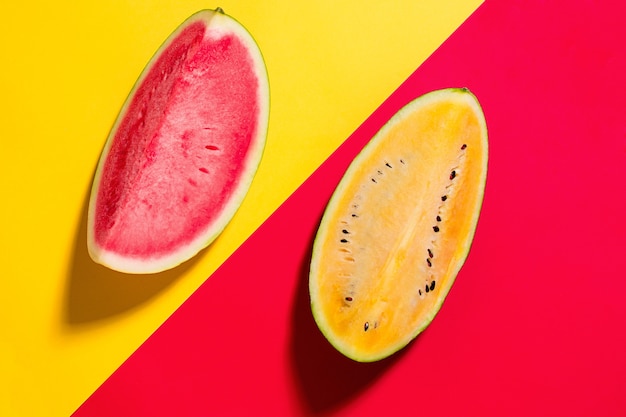 The fresh watermelon on yellow and red studio background