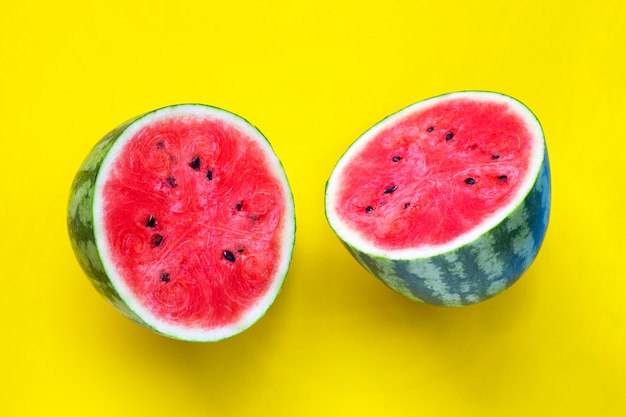 Fresh watermelon on yellow surface