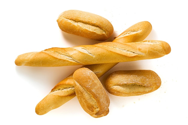 Fresh white bread baguette and bun isolated on a white background with seeds