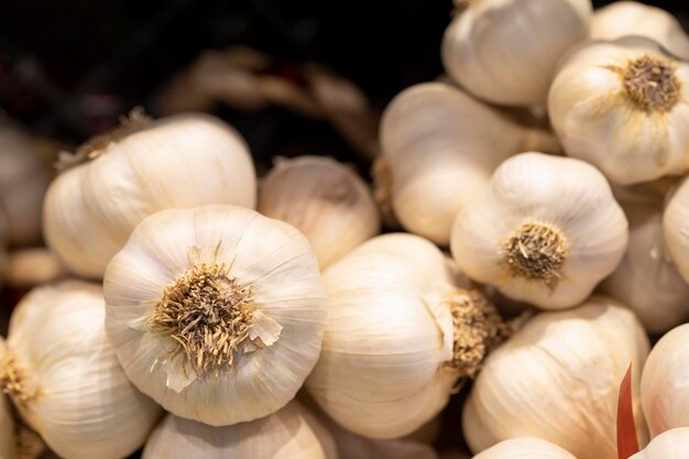 Fresh white garlic garlic in bulk close up of garlic background