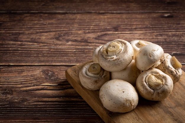 Fresh white mushrooms on the table