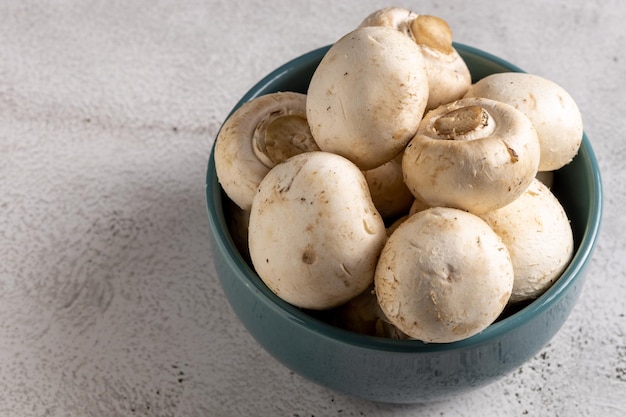 Fresh white mushrooms on the table