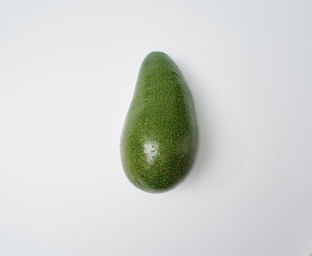 Fresh whole avocado on white background