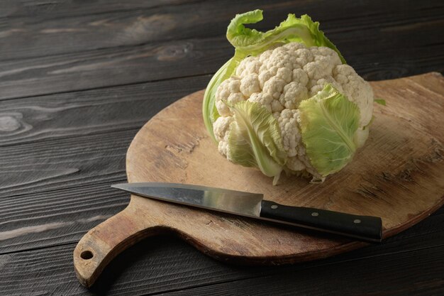 Fresh whole cauliflower on wooden rustic background top