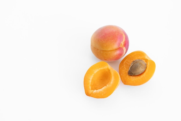 Fresh whole and sliced apricot Isolated White background