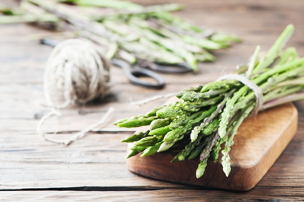 Fresh wild asparagus on the wooden table