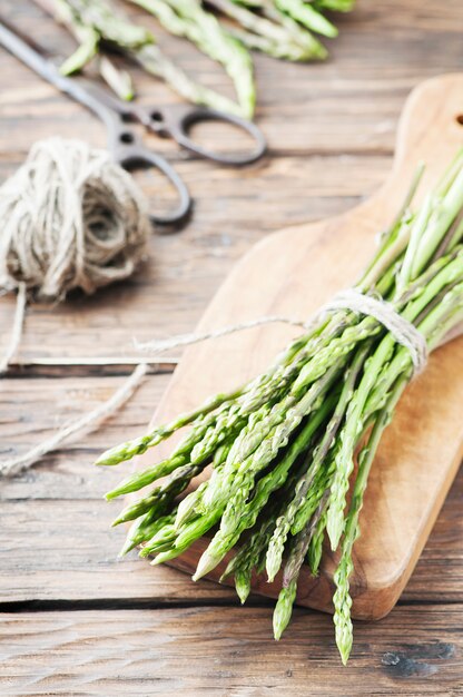 Fresh wild asparagus on the wooden table