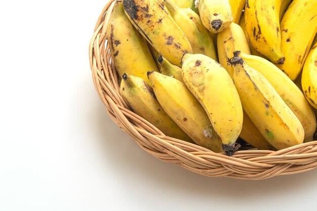 fresh yellow bananas in basket isolated on white background