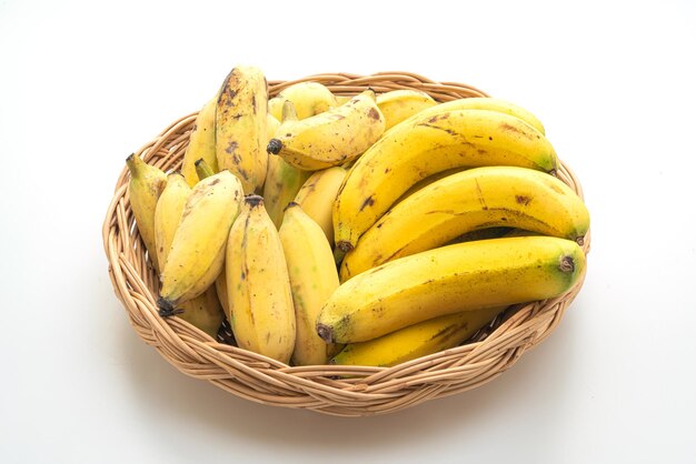 fresh yellow bananas in basket isolated on white background