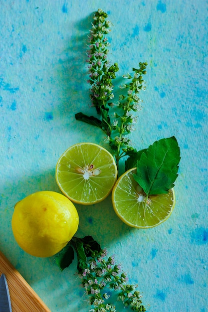 fresh yellow and green lemon on blue background