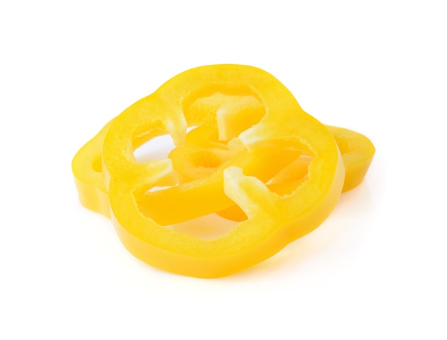 Fresh yellow pepper slices isolated on white