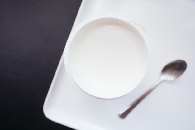 Fresh yogurt in a bowl on table