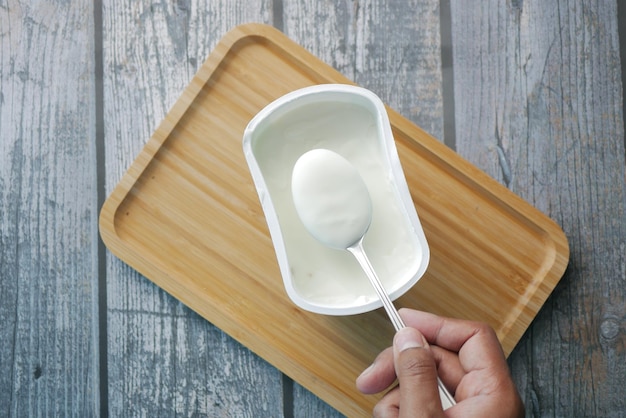 Fresh yogurt in a bowl on table