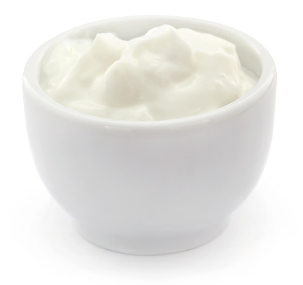 Fresh yogurt in a small bowl over white background