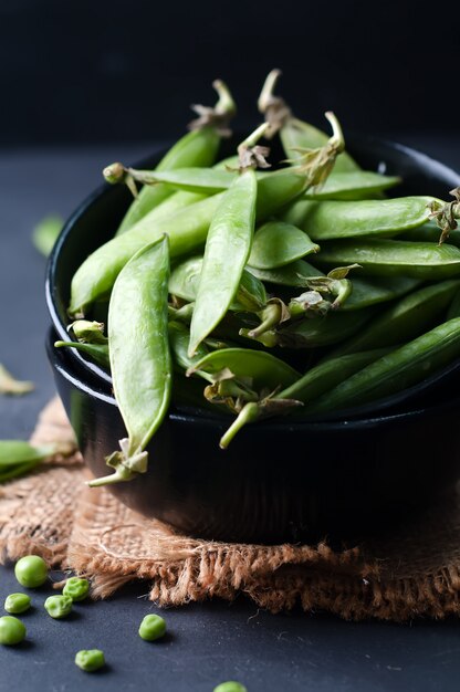 Fresh, young, unpeeled green peas