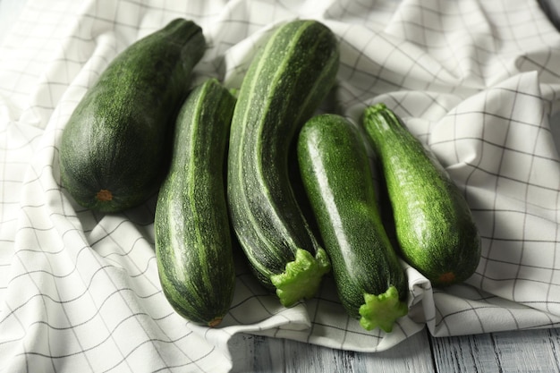 Fresh zucchini on napkin closeup