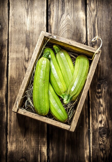 Fresh zucchini in an old box.