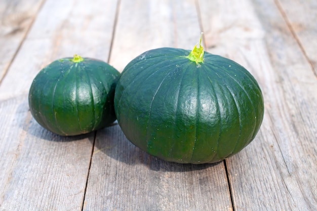 Fresh zucchini round on a wooden table