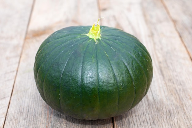 Fresh zucchini round on a wooden table