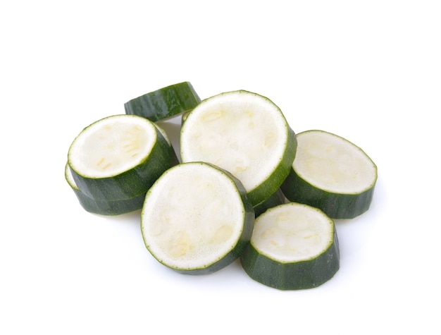 Fresh zucchini sliced on white