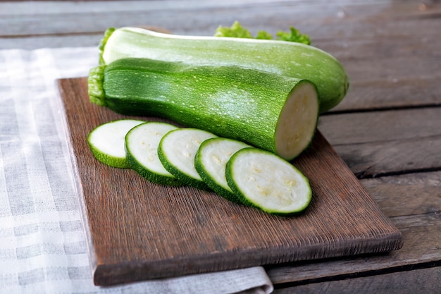 Fresh zucchini with squash on cutting board