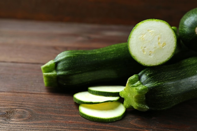 Fresh zucchini on wooden background