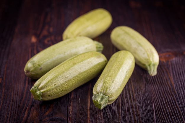 Fresh zucchini on wooden table