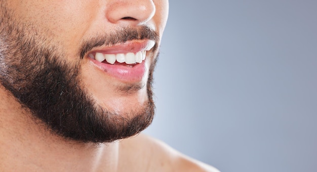 The freshest smile since forever Cropped studio shot of an unrecognisable man smiling against a grey background