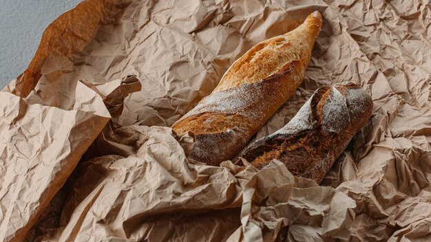 Freshly baked baguette isolated on white background top\
view