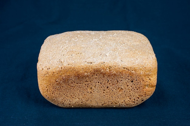 The freshly baked bread on a black background closeup making bread