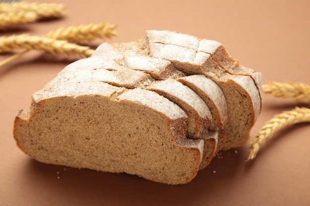 Freshly baked bread on dark brown background