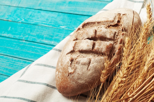 Freshly baked bread on wooden table