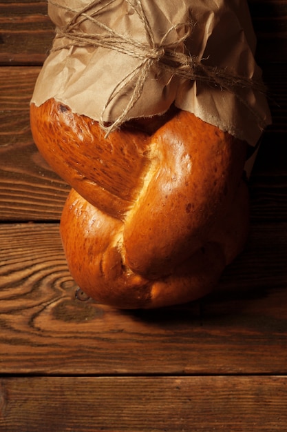 Freshly baked bread on wooden table