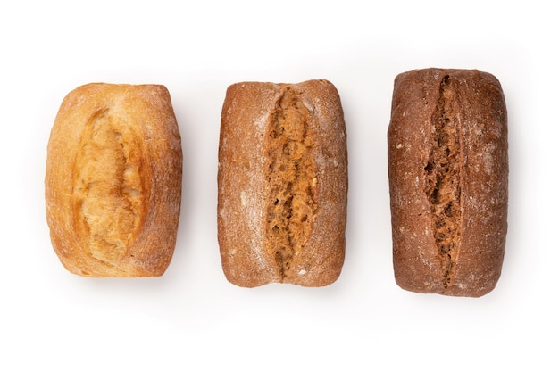 Photo freshly baked buns of different sorts wheat and rye isolated on white with shadow